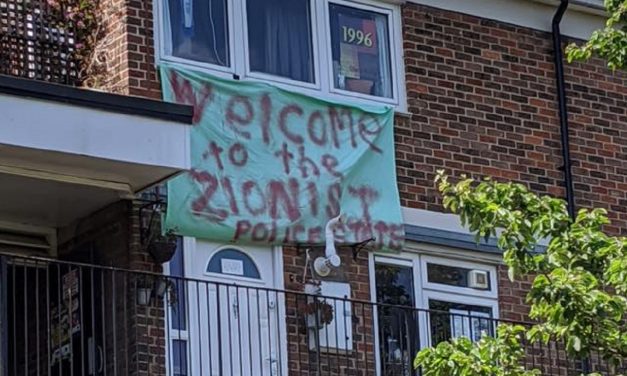 UK: Anti-Semitic ‘Zionist police state’ banner hung from window in Tower Hamlets