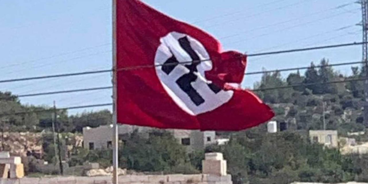 Palestinians fly Nazi flag near Hebron; IDF soldier shoots it down